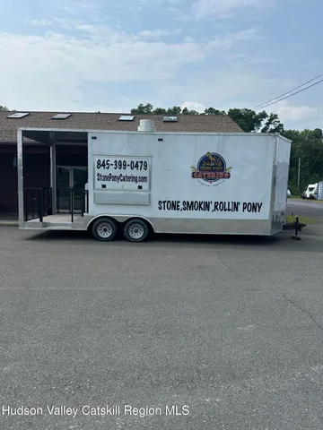 a view of a car in front of a building