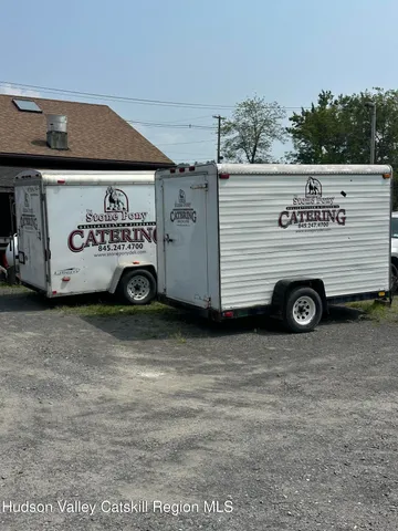 a view of a car in front of a building