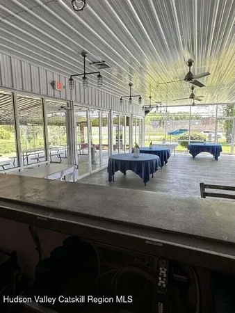 a kitchen with a sink and large window