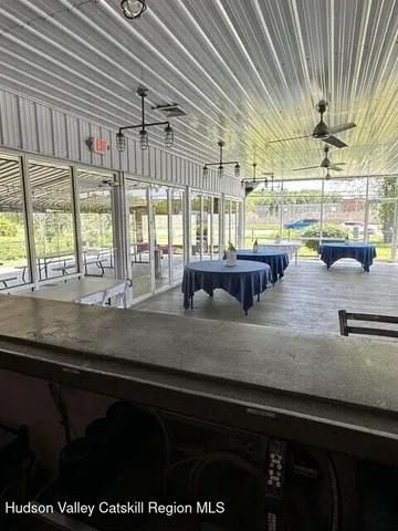 a kitchen with a sink and large window