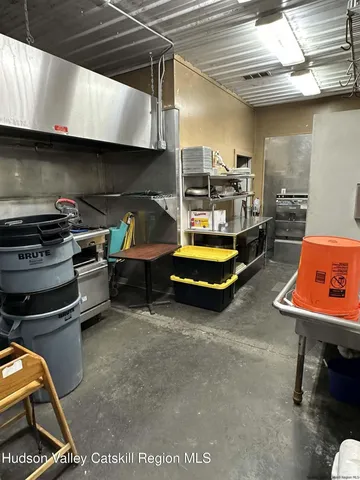 a kitchen with stove and cabinets