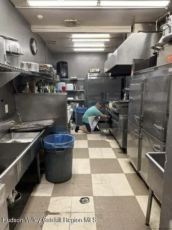 a kitchen with a stove and a refrigerator