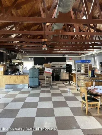a view of a gym with wooden floor