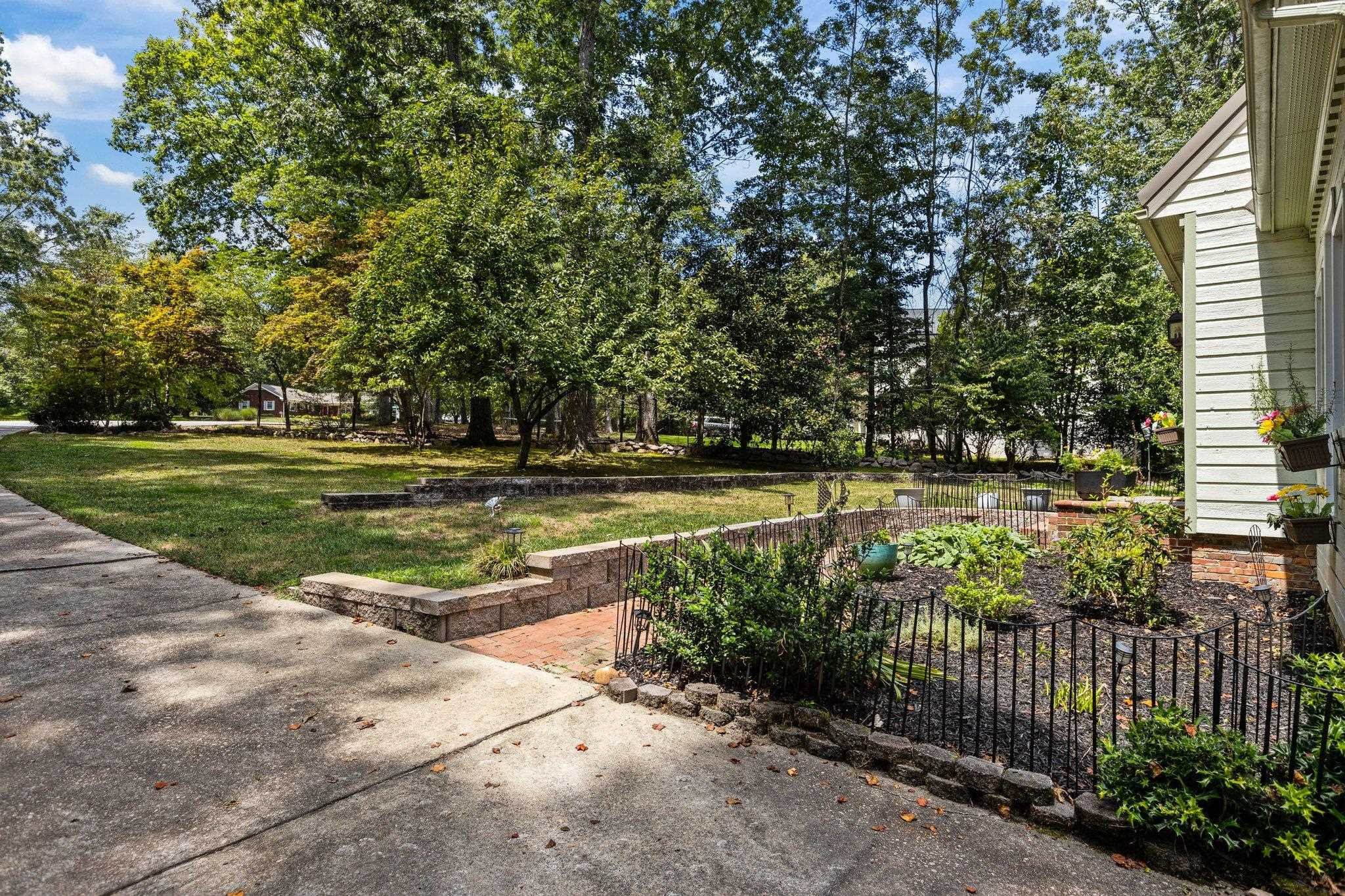 11302 Rumshill Road Raleigh, NC 27614 - Photo 39 of 51 a view of a swimming pool with a garden