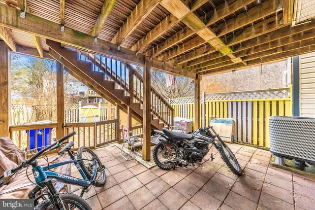 a view of living room with furniture and floor to ceiling windows
