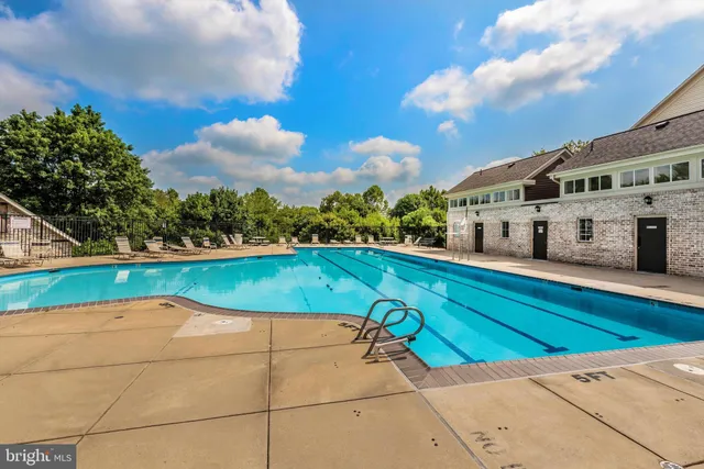a view of swimming pool with a yard