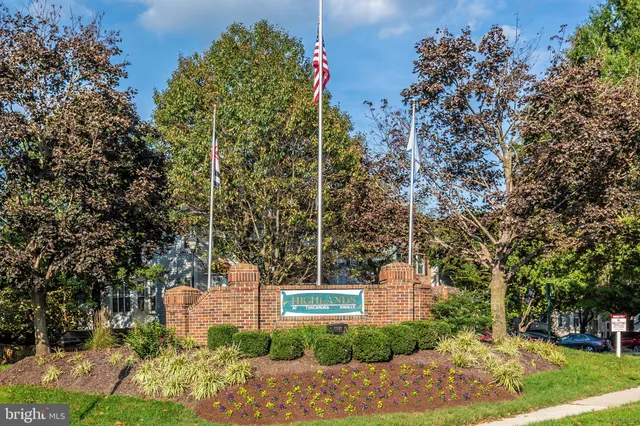 a view of a multi story building with a yard