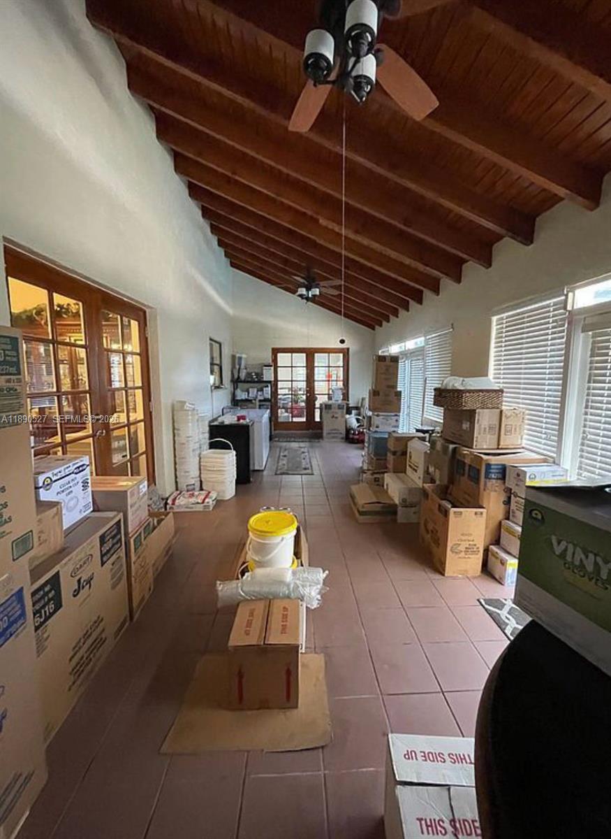 15181 Southwest 156th Terrace Miami, FL 33187 - Photo 11 of 43 a living room with furniture and a flat screen tv