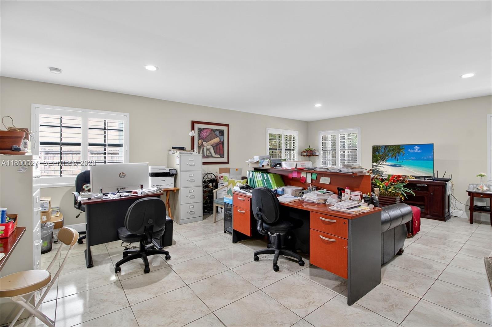 15181 Southwest 156th Terrace Miami, FL 33187 - Photo 17 of 32 a view of a workspace with furniture and a workspace