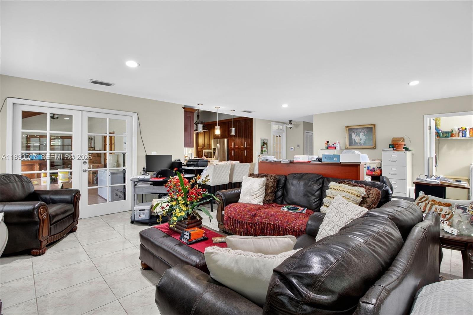 15181 Southwest 156th Terrace Miami, FL 33187 - Photo 19 of 32 a living room with furniture and a flat screen tv