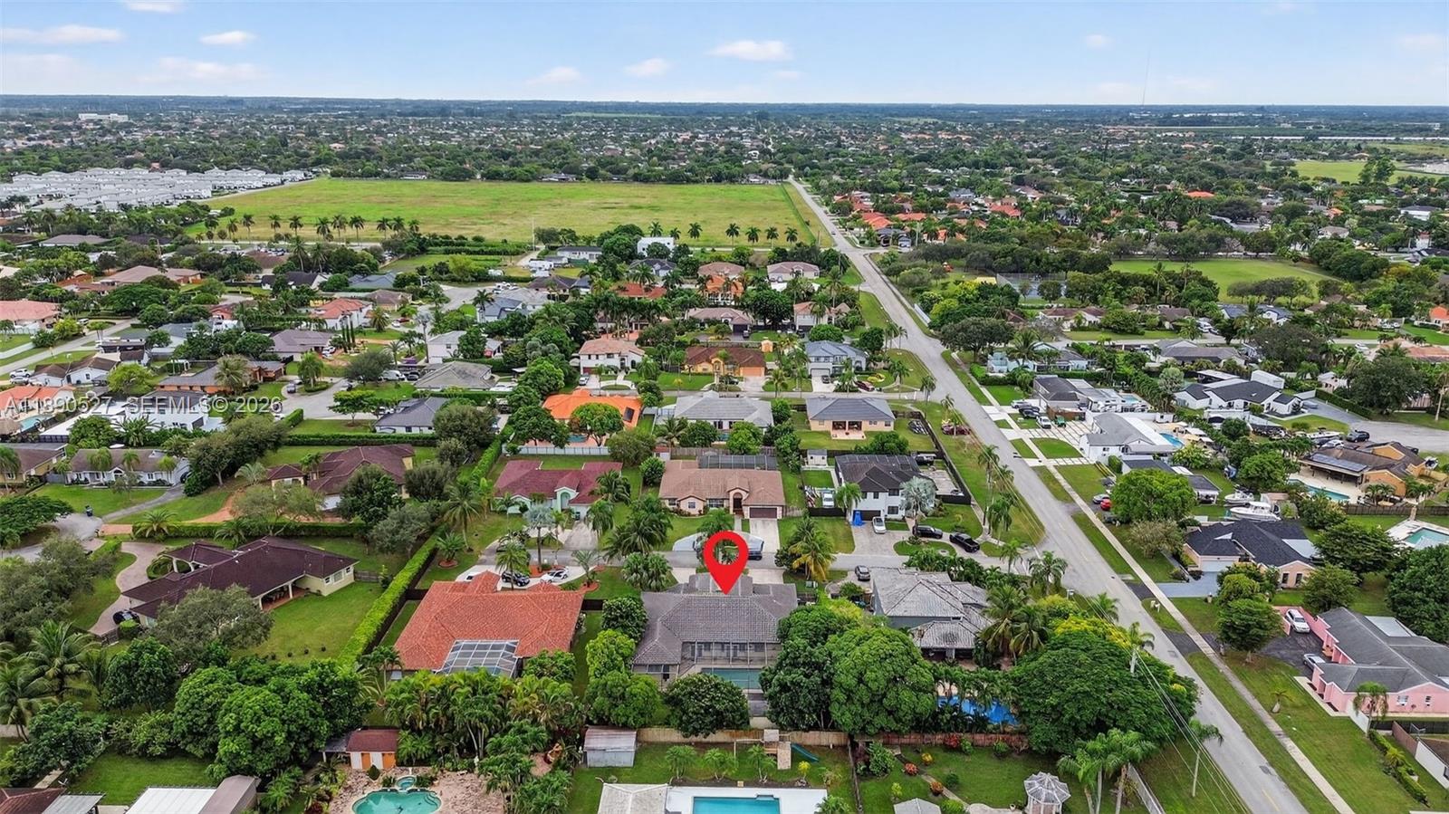 15181 Southwest 156th Terrace Miami, FL 33187 - Photo 29 of 32 an aerial view of residential houses with outdoor space and swimming pool