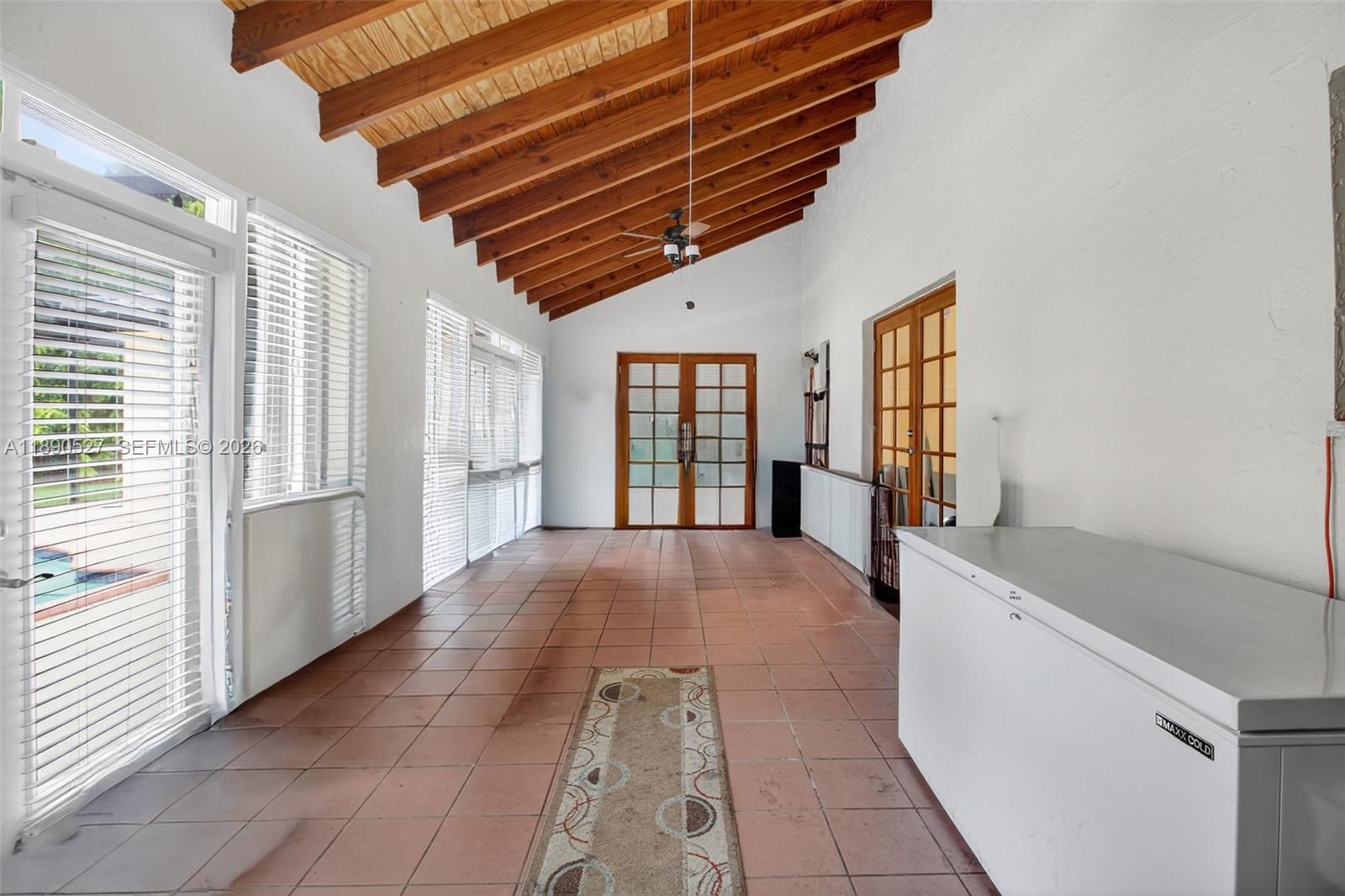 15181 Southwest 156th Terrace Miami, FL 33187 - Photo 31 of 43 a view of hallway with windows and chandelier
