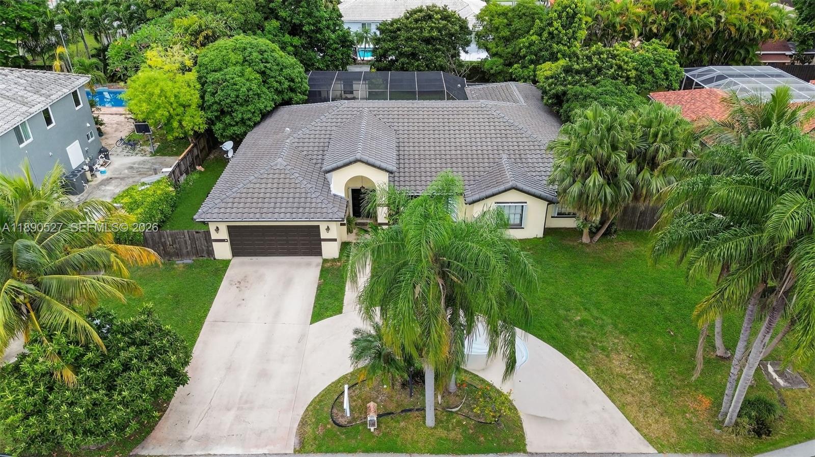 15181 Southwest 156th Terrace Miami, FL 33187 - Photo 34 of 43 a aerial view of a house with a yard