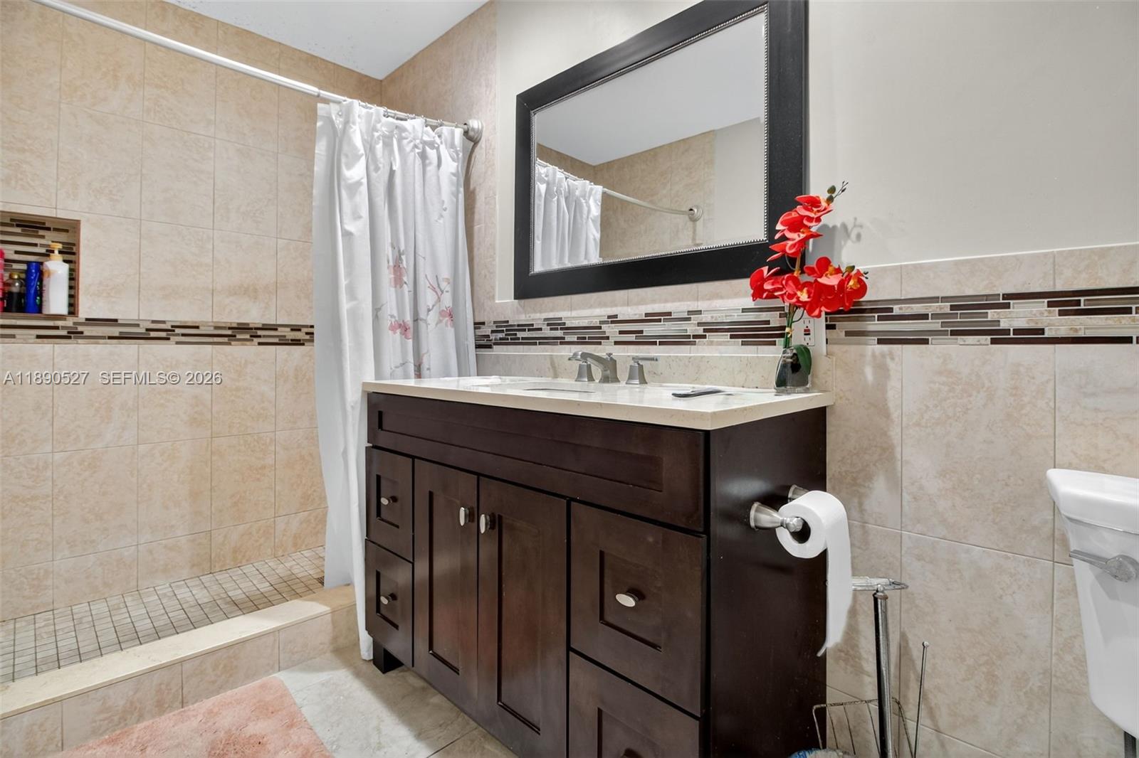 15181 Southwest 156th Terrace Miami, FL 33187 - Photo 42 of 43 a bathroom with a sink vanity and a mirror