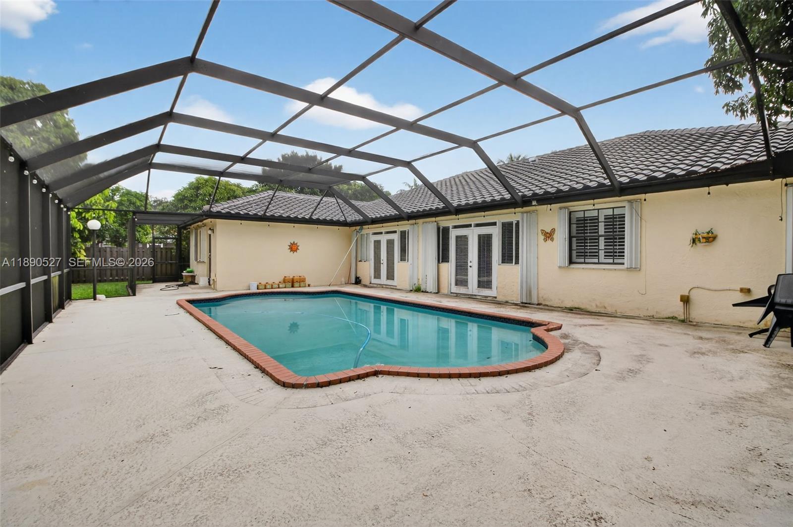 15181 Southwest 156th Terrace Miami, FL 33187 - Photo 5 of 43 a view of a backyard