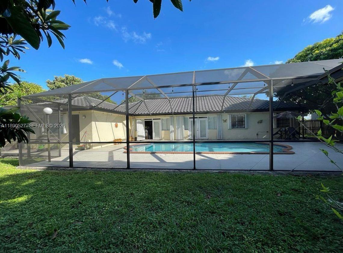 15181 Southwest 156th Terrace Miami, FL 33187 - Photo 6 of 32 a view of a backyard