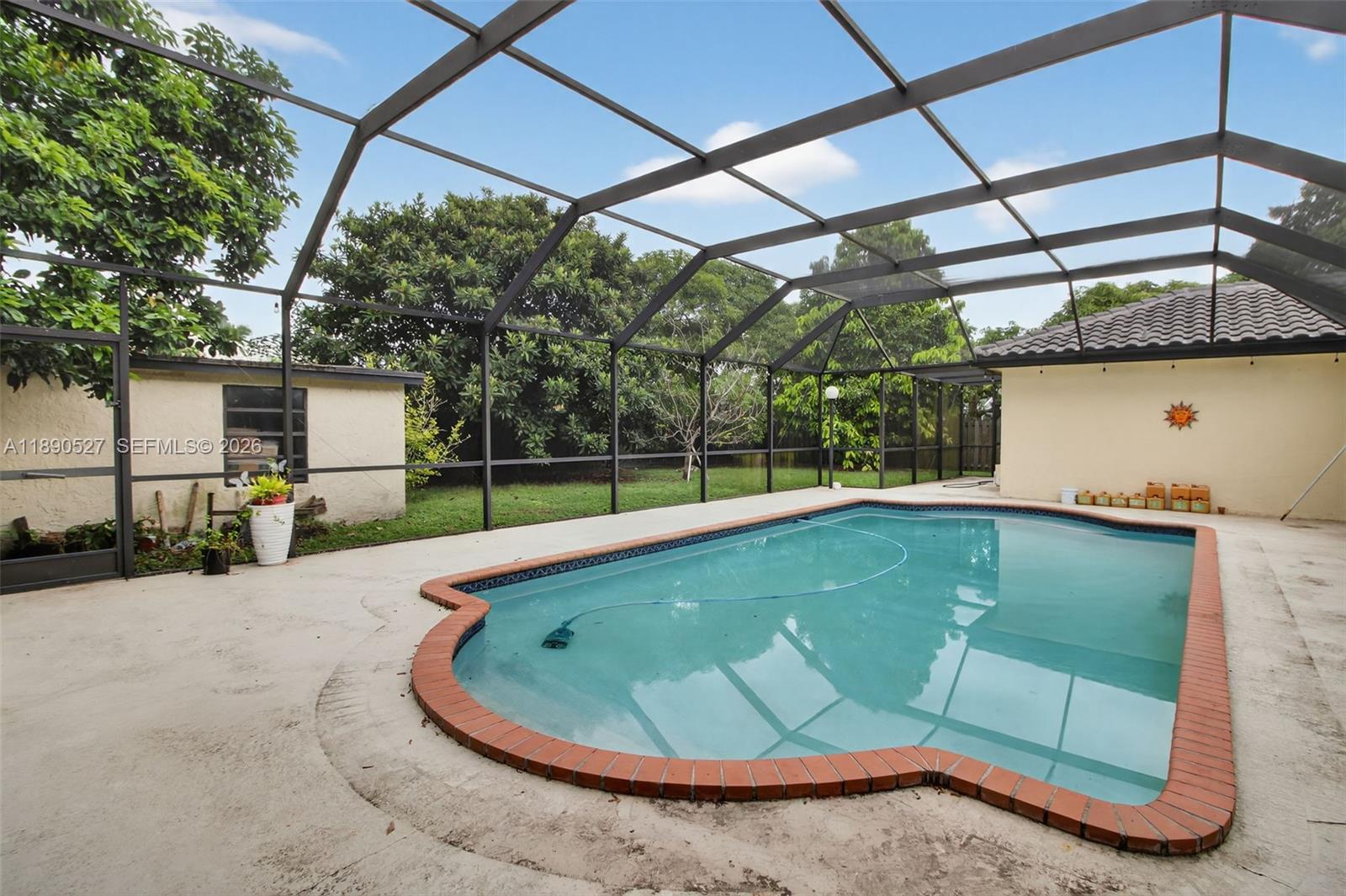 15181 Southwest 156th Terrace Miami, FL 33187 - Photo 6 of 43 a view of outdoor space and swimming pool