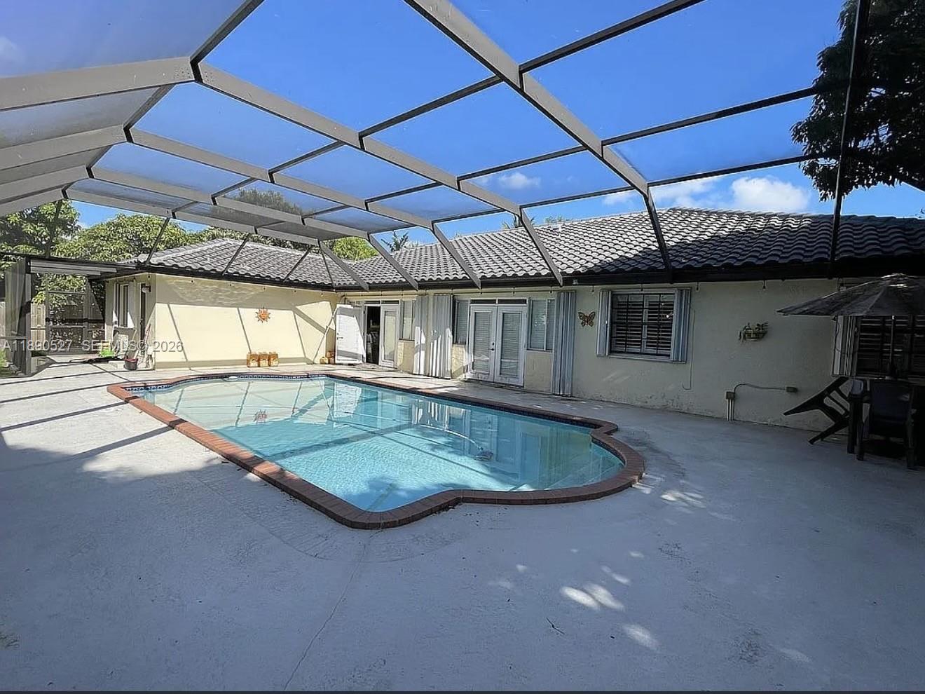 15181 Southwest 156th Terrace Miami, FL 33187 - Photo 9 of 43 a view of a backyard with a patio