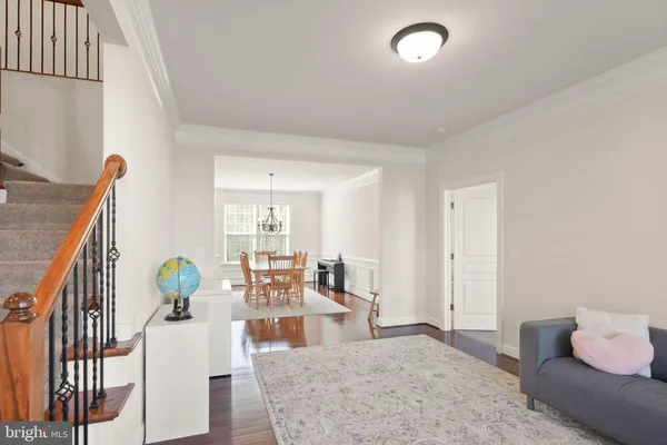a kitchen with stainless steel appliances kitchen island granite countertop a kitchen island hardwood floor sink and stove