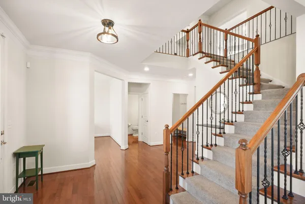 a kitchen with stainless steel appliances granite countertop a stove refrigerator sink and cabinets