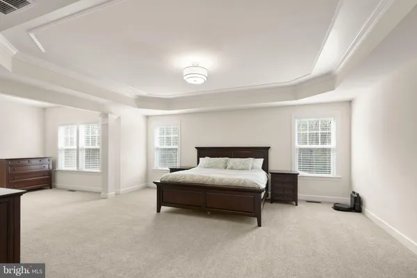 a bedroom with furniture and a window