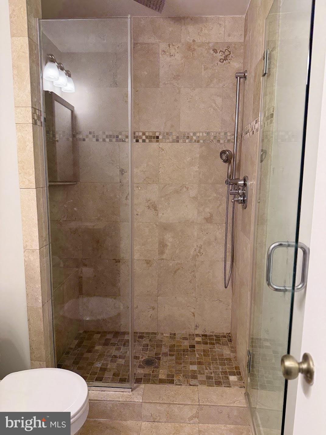 18290 Rolling Meadow Way, Unit 4 Olney, MD 20832 - Photo 13 of 18 a bathroom with a shower and a toilet