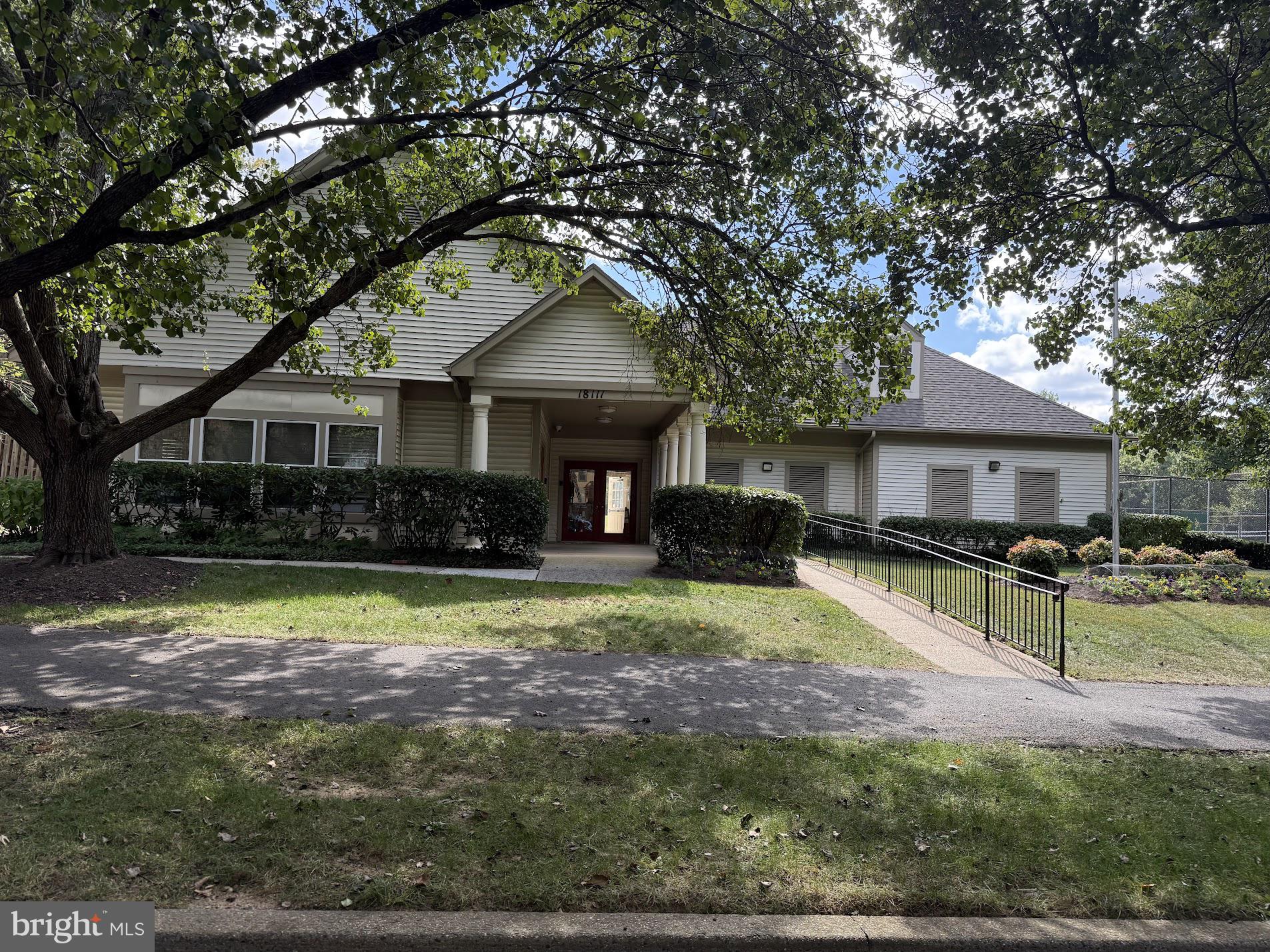 18290 Rolling Meadow Way, Unit 4 Olney, MD 20832 - Photo 17 of 18 a front view of a house with a yard
