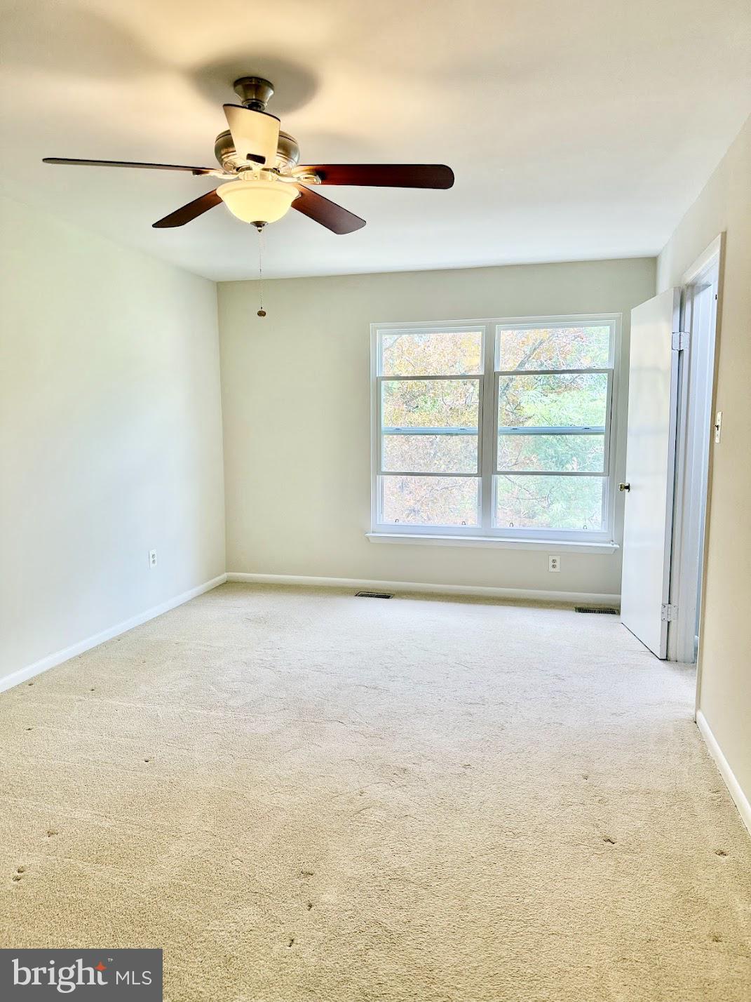 18290 Rolling Meadow Way, Unit 4 Olney, MD 20832 - Photo 2 of 18 a view of an empty room with a window