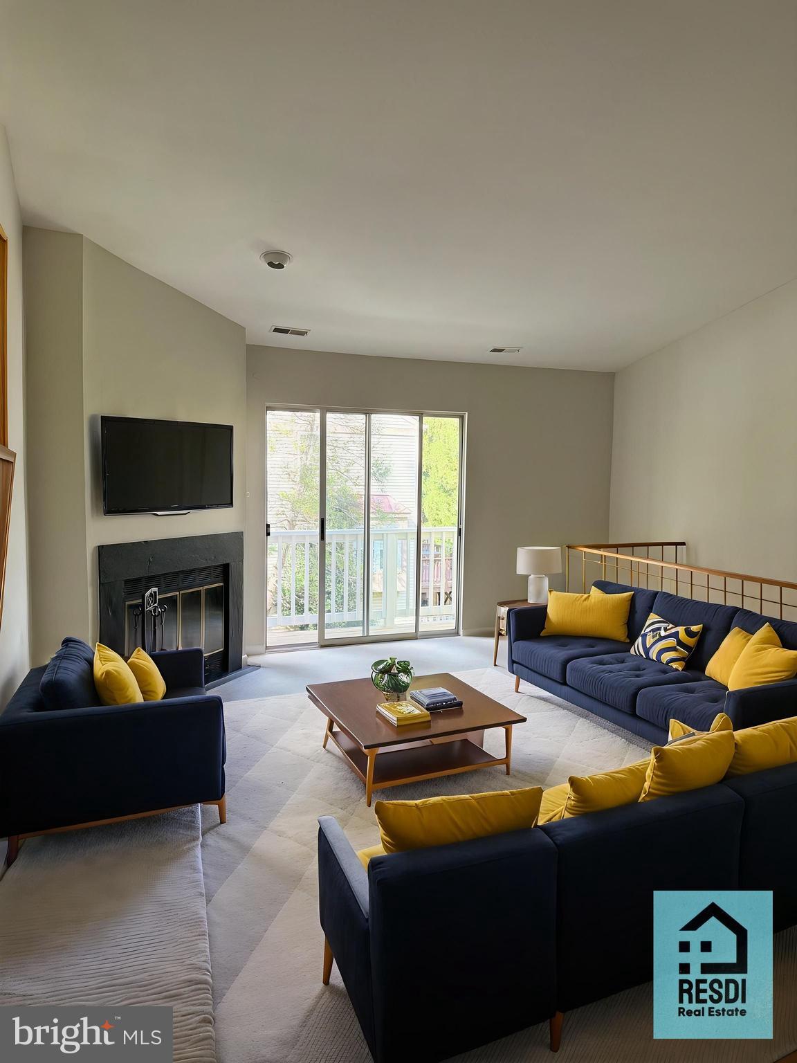 18290 Rolling Meadow Way, Unit 4 Olney, MD 20832 - Photo 2 of 18 a living room with furniture a fireplace and a flat screen tv