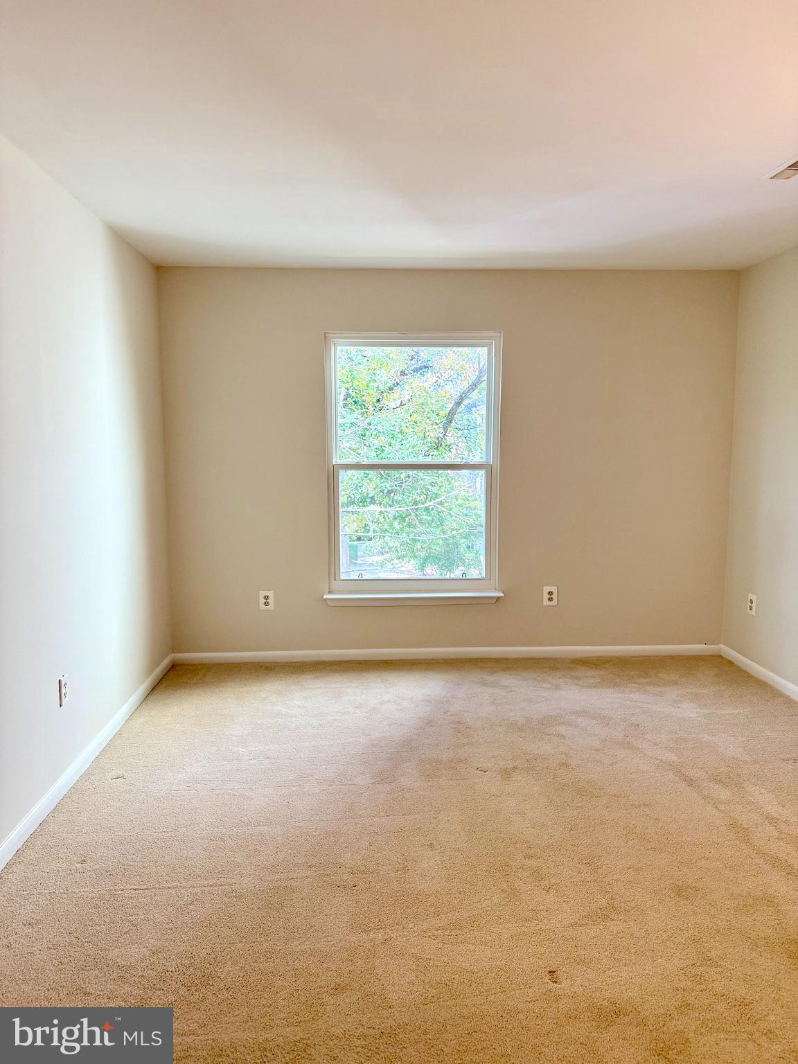 18290 Rolling Meadow Way, Unit 4 Olney, MD 20832 - Photo 6 of 18 an empty room with a window