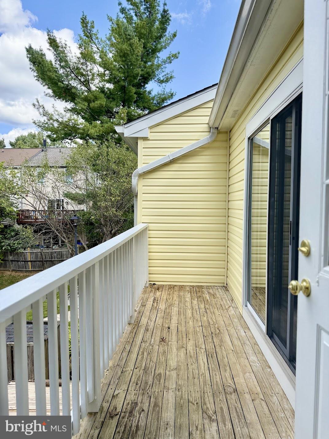 18290 Rolling Meadow Way, Unit 4 Olney, MD 20832 - Photo 10 of 18 a view of a balcony with wooden floor