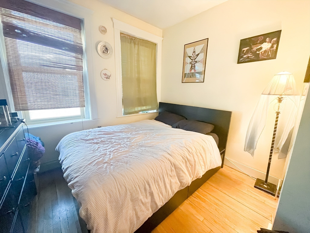 12 Ransom Road, Unit 6 Boston, MA 02135 - Photo 11 of 16 a bedroom with a bed and a window