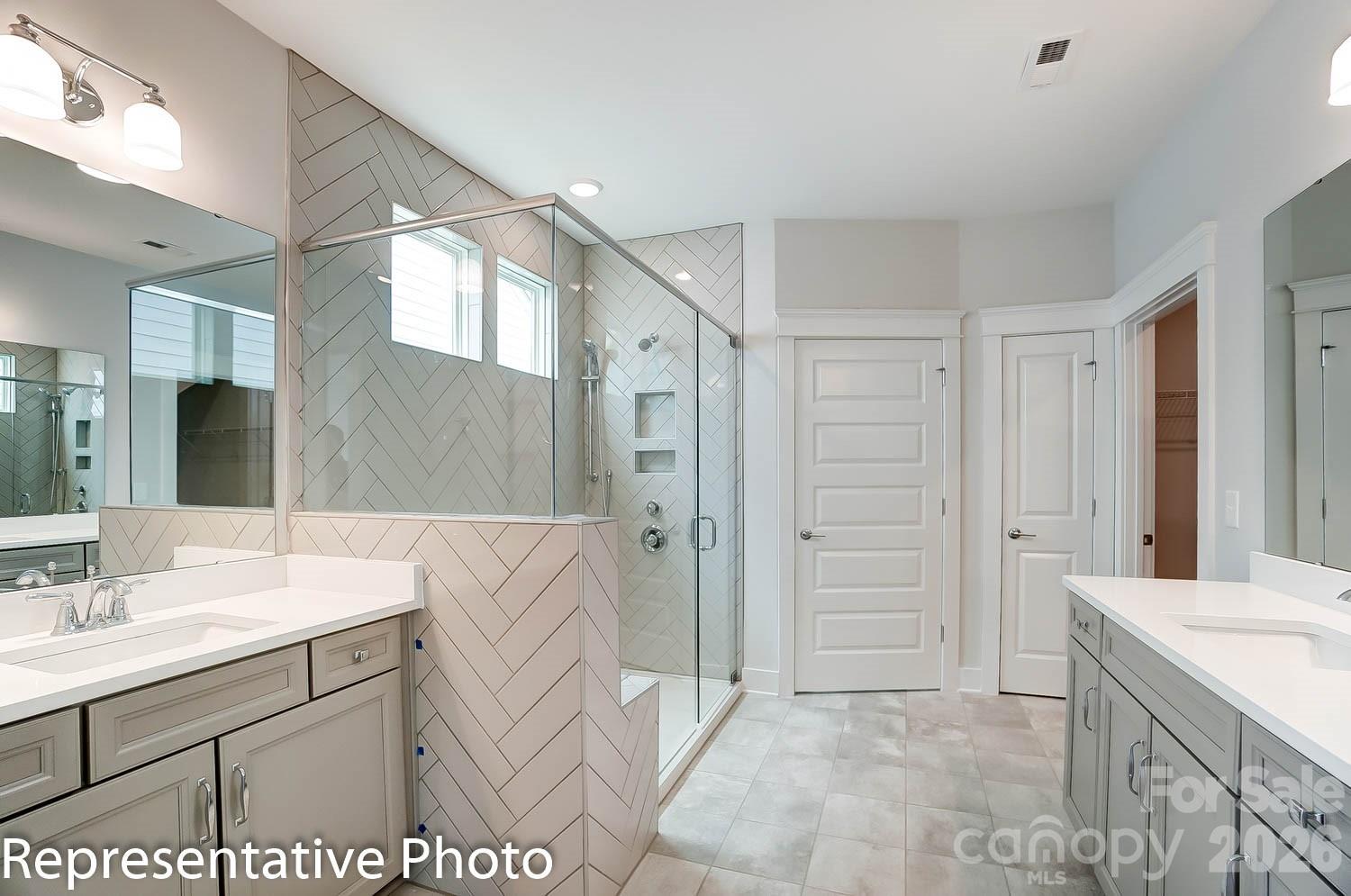 2245 Tabor Road Sherrills Ford, NC 28673 - Photo 12 of 34 a bathroom with a sink vanity granite tub shower and a mirror