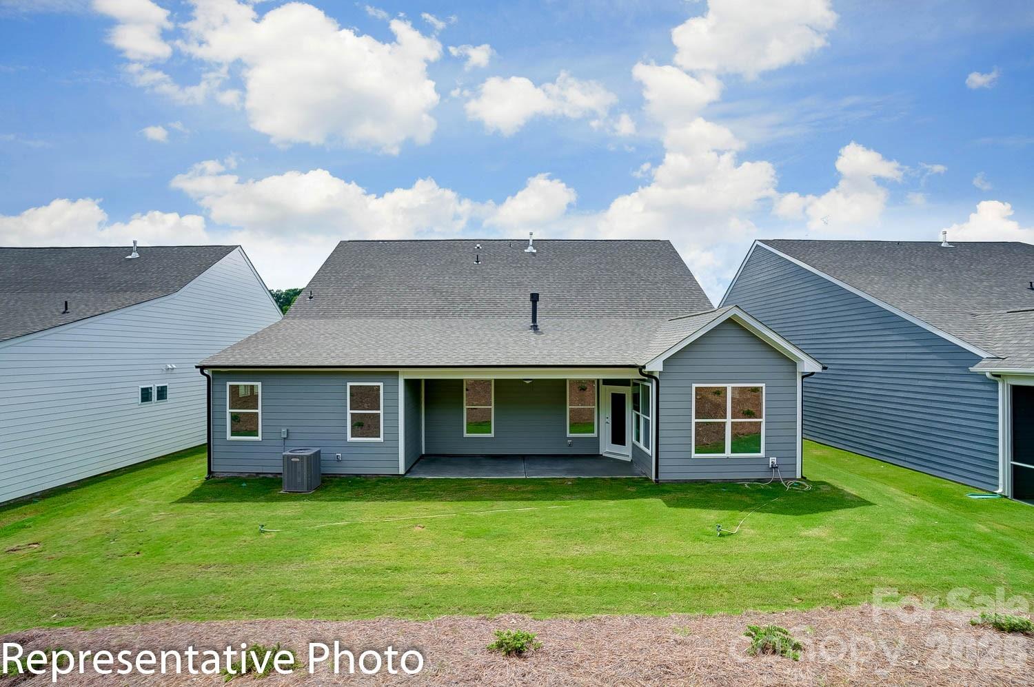 2245 Tabor Road Sherrills Ford, NC 28673 - Photo 25 of 34 a view of a house with a backyard