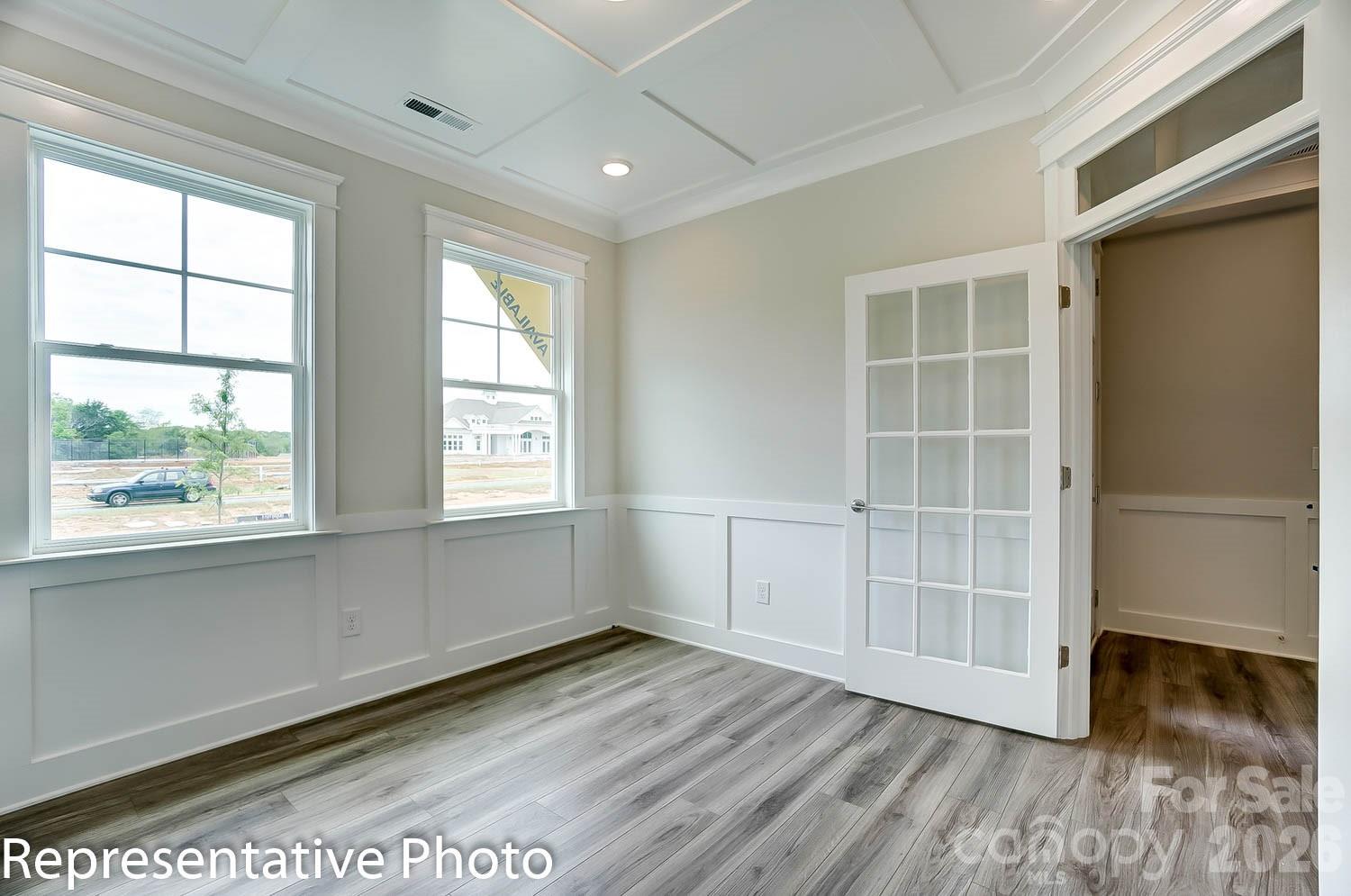 2245 Tabor Road Sherrills Ford, NC 28673 - Photo 4 of 34 an empty room with wooden floor and windows
