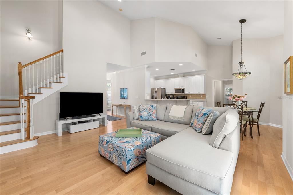 7418 White Oaks Road Alachua, FL 32615 - Photo 26 of 46 a living room with furniture and a flat screen tv