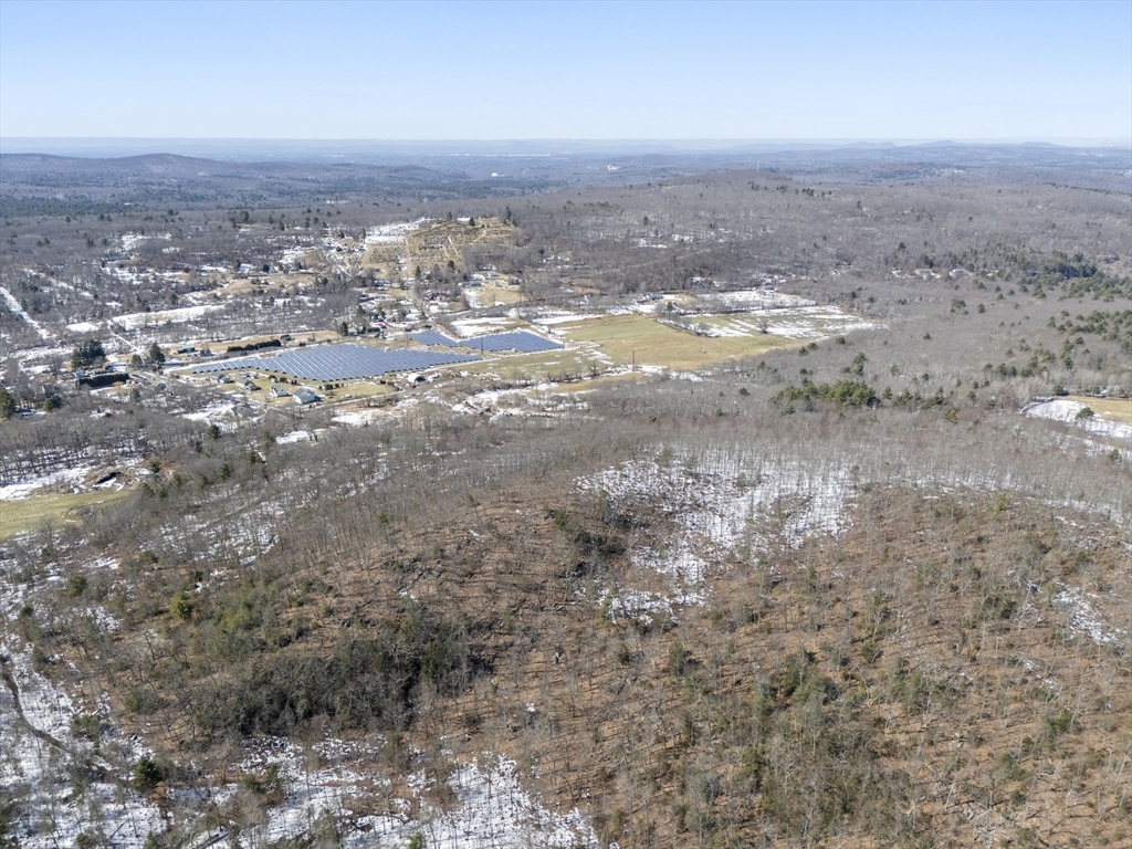 22-25 Macomber Road Monson, MA 01057 - Photo 12 of 34 a view of a dry yard with wooden floor and lake view
