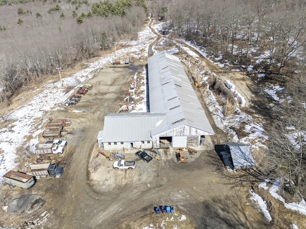 22-25 Macomber Road Monson, MA 01057 - Photo 19 of 34 a view of a house with a patio