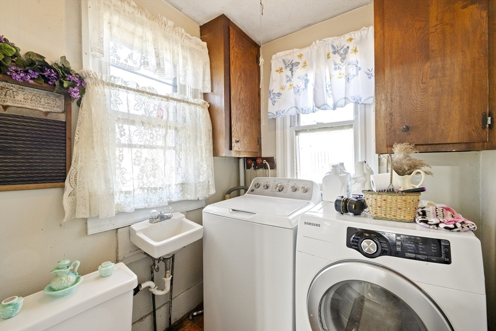 22-25 Macomber Road Monson, MA 01057 - Photo 21 of 34 a utility room with dryer and washer