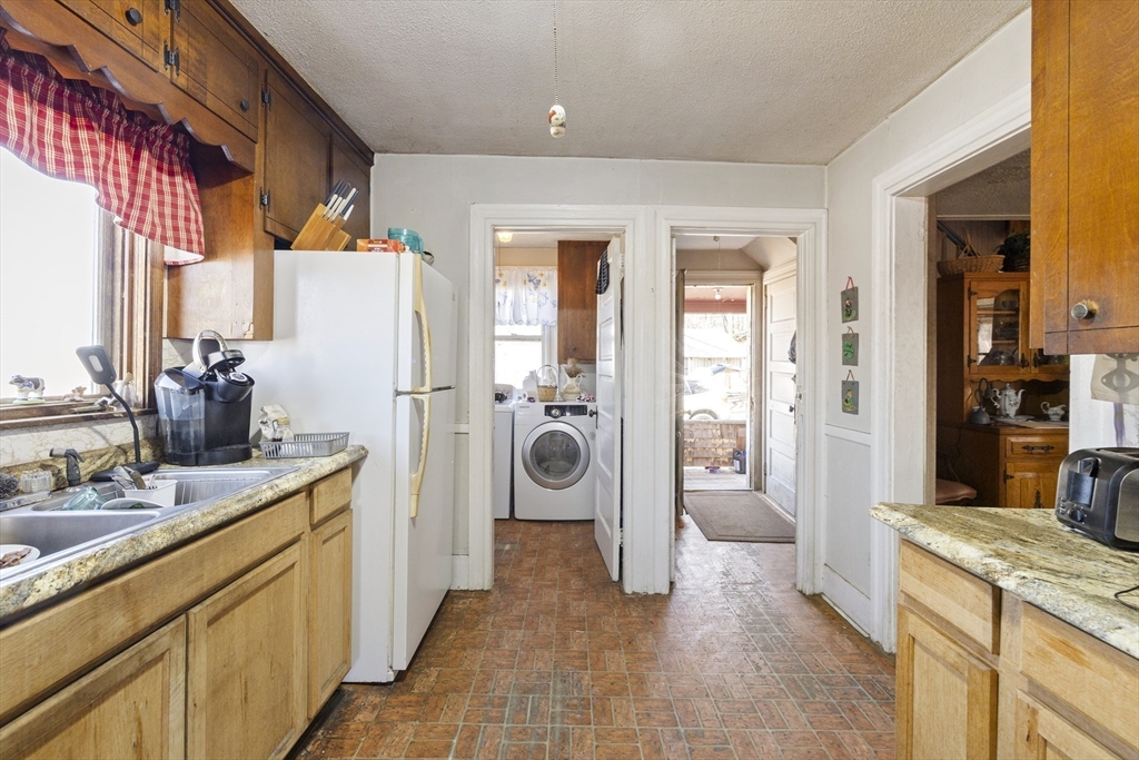 22-25 Macomber Road Monson, MA 01057 - Photo 22 of 34 a kitchen with refrigerator and car