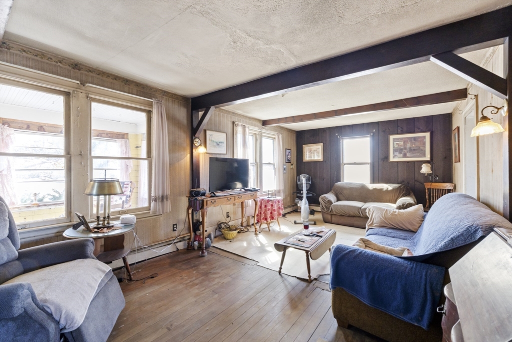 22-25 Macomber Road Monson, MA 01057 - Photo 23 of 34 a living room with furniture and a flat screen tv