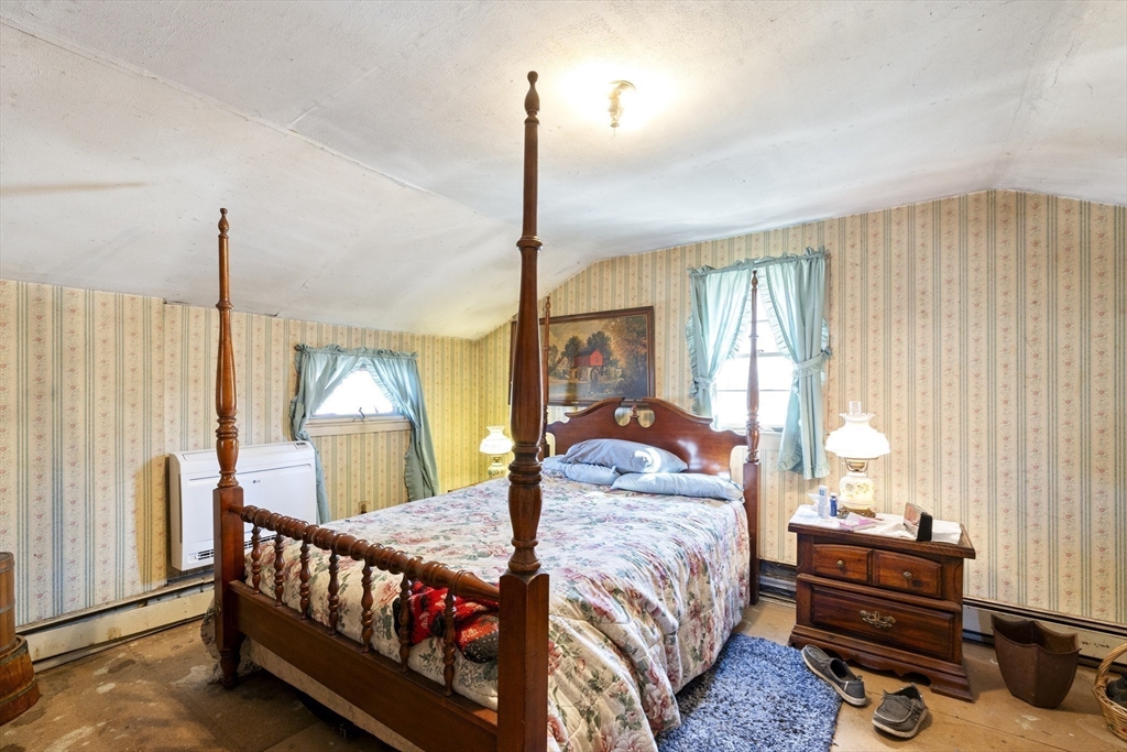 22-25 Macomber Road Monson, MA 01057 - Photo 27 of 34 a living room with a bed furniture and a window