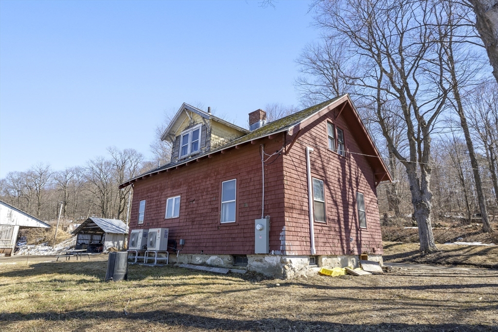 22-25 Macomber Road Monson, MA 01057 - Photo 4 of 34 a view of a house with a yard and garage