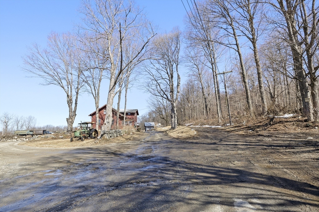 22-25 Macomber Road Monson, MA 01057 - Photo 5 of 34 a view of dirt yard with a fountain