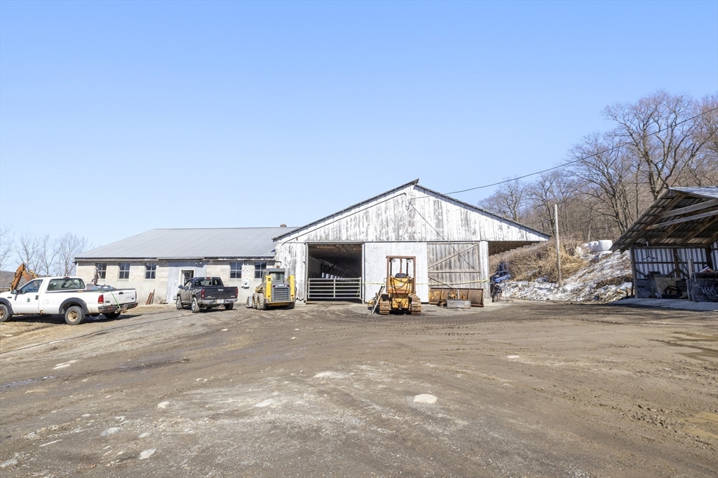 22-25 Macomber Road Monson, MA 01057 - Photo 6 of 34 a view of a cars parked in front of a building