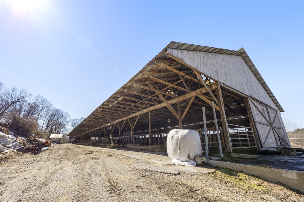 22-25 Macomber Road Monson, MA 01057 - Photo 9 of 34 a view of a roof and wooden fence