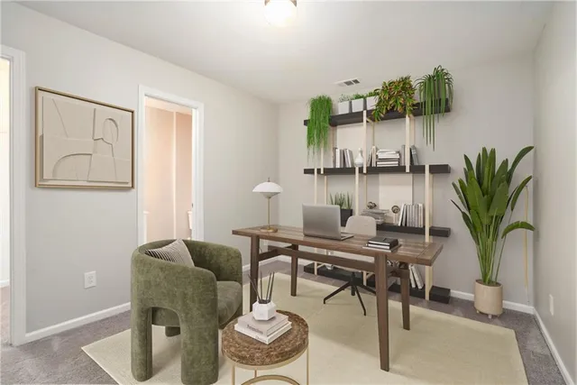 a workspace with furniture and potted plant