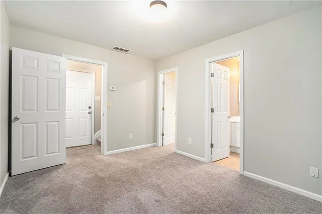 an empty room with closet area