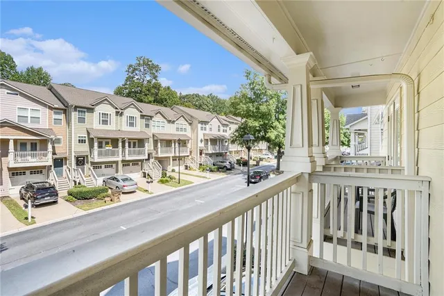 a view of a house with sitting area and swimming pool