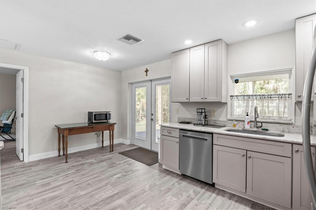 6244 Colony Circle Weeki Wachee, FL 34607 - Photo 44 of 60 a kitchen with a sink cabinets and wooden floor